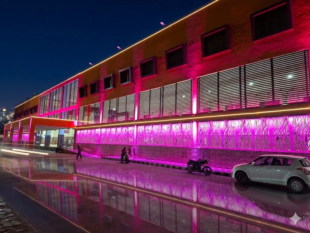 Mehsana railway station facade lit in magenta
