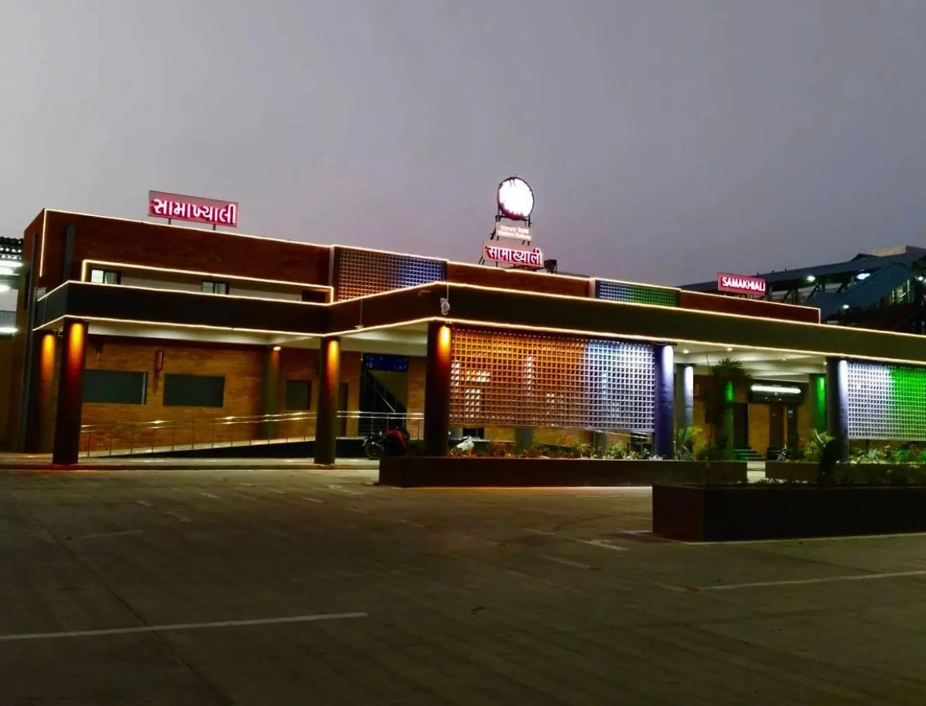 Samakhiali railway station facade lit at night